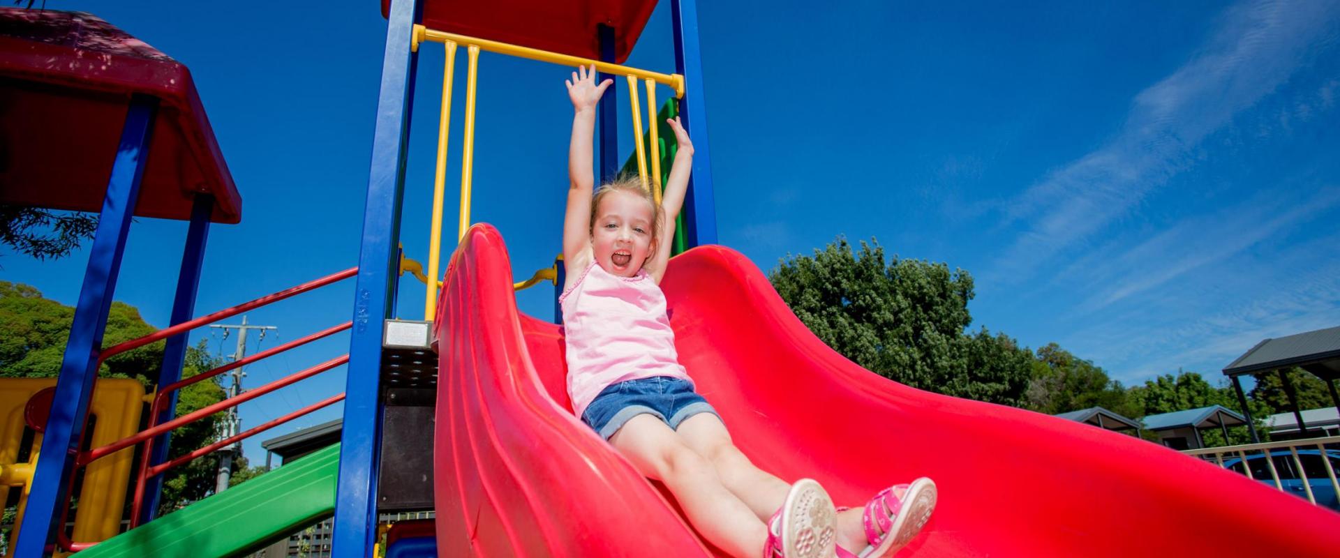 BIG4 Shepparton Park Lane Holiday Park - Playground - Girl on slide